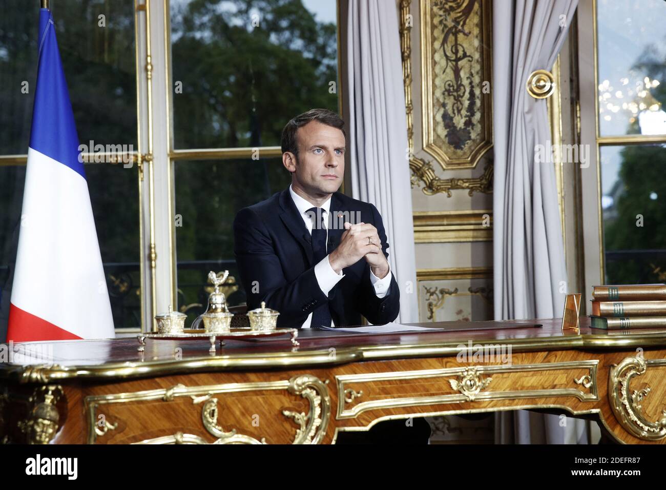 French President Emmanuel Macron sits at his desk after addressing the  French nation following a massive fire at Notre Dame Cathedral, at Elysee  Palace in Paris, France, 16 April 2019. Macron canceled