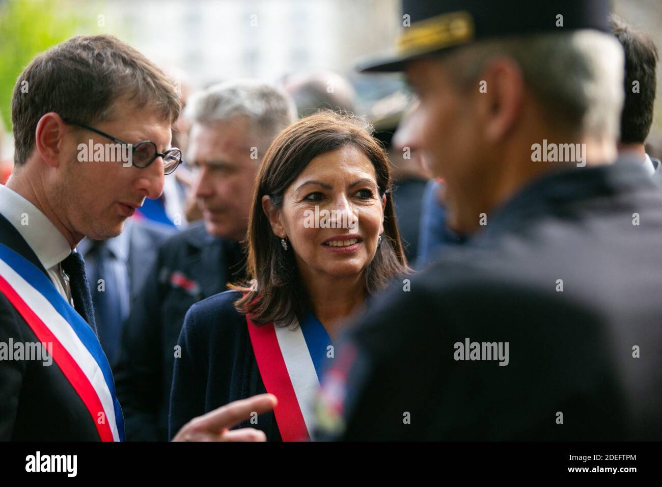 Paris mayor Anne Hidalgo and outside Notre Dame cathedral after a ceremony at the city town hall on April 18, 2019 in Paris. France paid a daylong tribute on April 18, 2019 to the Paris firefighters who saved Notre Dame Cathedral from collapse, while construction workers rushed to secure an area above one of the church's famed rose-shaped windows and other vulnerable sections of the fire-damaged landmark. Photo by Pierre Gautheron/ABACAPRESS.COM Stock Photo
