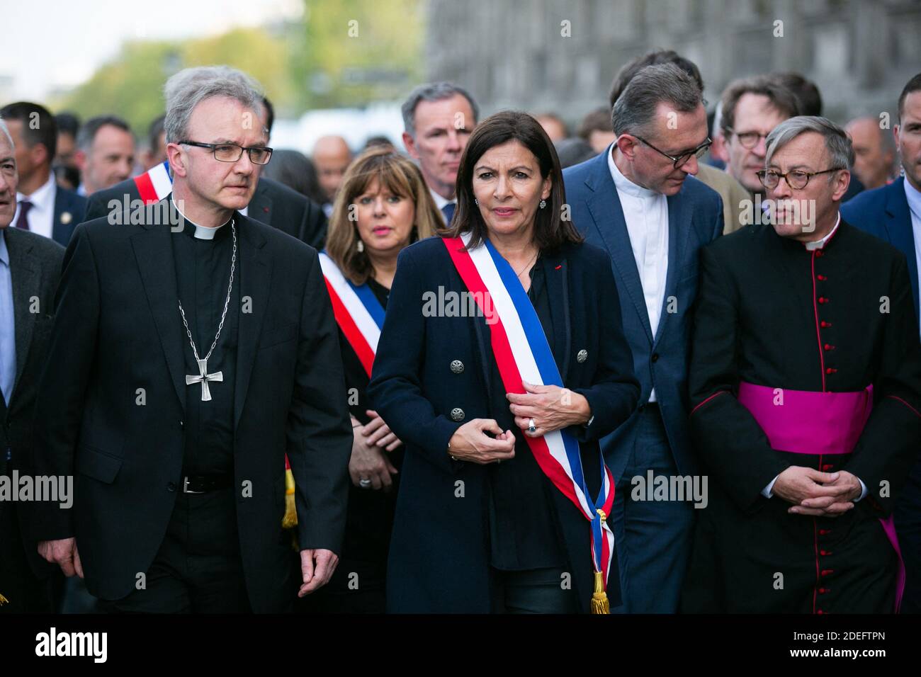 Paris mayor Anne Hidalgo and outside Notre Dame cathedral after a ceremony at the city town hall on April 18, 2019 in Paris. France paid a daylong tribute on April 18, 2019 to the Paris firefighters who saved Notre Dame Cathedral from collapse, while construction workers rushed to secure an area above one of the church's famed rose-shaped windows and other vulnerable sections of the fire-damaged landmark. Photo by Pierre Gautheron/ABACAPRESS.COM Stock Photo