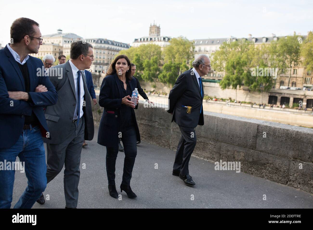 Anne Hidalgo Walks by the Seine front of Notre Dame cathedral on April 18, 2019 in Paris. France paid a daylong tribute on April 18, 2019 to the Paris firefighters who saved Notre Dame Cathedral from collapse, while construction workers rushed to secure an area above one of the church's famed rose-shaped windows and other vulnerable sections of the fire-damaged landmark. Photo by Raphael Lafargue/ABACAPRESS.COM Stock Photo