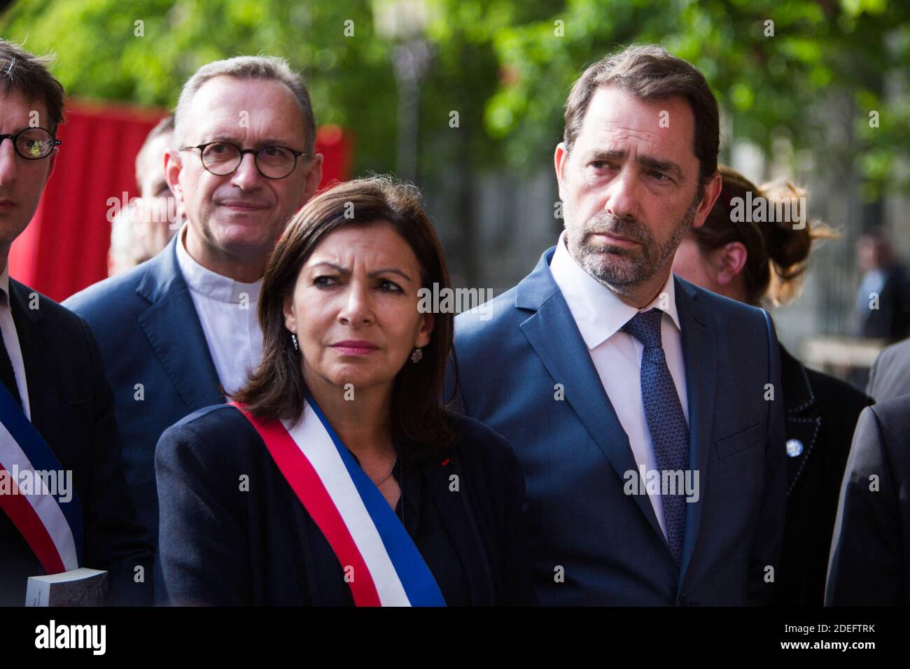 French Interior Minister Christophe Castaner, Paris prefect Didier Lallement, Paris mayor Anne Hidalgo, and other officials walk by Notre Dame cathedral on April 18, 2019 in Paris. France paid a daylong tribute on April 18, 2019 to the Paris firefighters who saved Notre Dame Cathedral from collapse, while construction workers rushed to secure an area above one of the church's famed rose-shaped windows and other vulnerable sections of the fire-damaged landmark. Photo by Raphael Lafargue/ABACAPRESS.COM Stock Photo