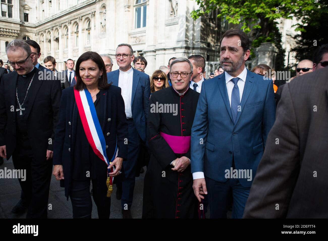 Jean-Marc Chauve, French Interior Minister Christophe Castaner, Paris prefect Didier Lallement, Paris mayor Anne Hidalgo, and other officials walk by Notre Dame cathedral on April 18, 2019 in Paris. France paid a daylong tribute on April 18, 2019 to the Paris firefighters who saved Notre Dame Cathedral from collapse, while construction workers rushed to secure an area above one of the church's famed rose-shaped windows and other vulnerable sections of the fire-damaged landmark. Photo by Raphael Lafargue/ABACAPRESS.COM Stock Photo