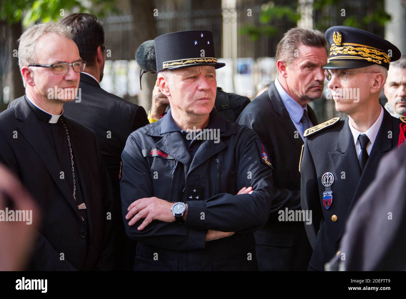 Jean-Claude Gallet General of the fire fighters of paris, next to Didier Lallement. Jean-Marc Chauve, French Interior Minister Christophe Castaner, Paris prefect Didier Lallement, Paris mayor Anne Hidalgo, and other officials walk by Notre Dame cathedral on April 18, 2019 in Paris. France paid a daylong tribute on April 18, 2019 to the Paris firefighters who saved Notre Dame Cathedral from collapse, while construction workers rushed to secure an area above one of the church's famed rose-shaped windows and other vulnerable sections of the fire-damaged landmark. Photo by Raphael Lafargue/ABACAPR Stock Photo