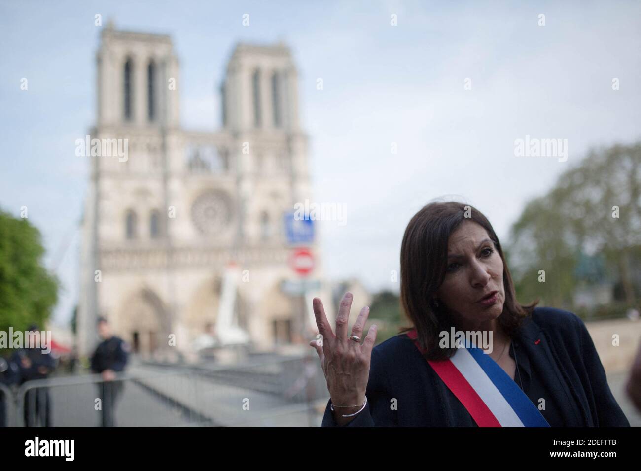Anne Hidalgo tours Notre Dame cathedral on April 18, 2019 in Paris. France paid a daylong tribute on April 18, 2019 to the Paris firefighters who saved Notre Dame Cathedral from collapse, while construction workers rushed to secure an area above one of the church's famed rose-shaped windows and other vulnerable sections of the fire-damaged landmark. Photo by Raphael Lafargue/ABACAPRESS.COM Stock Photo