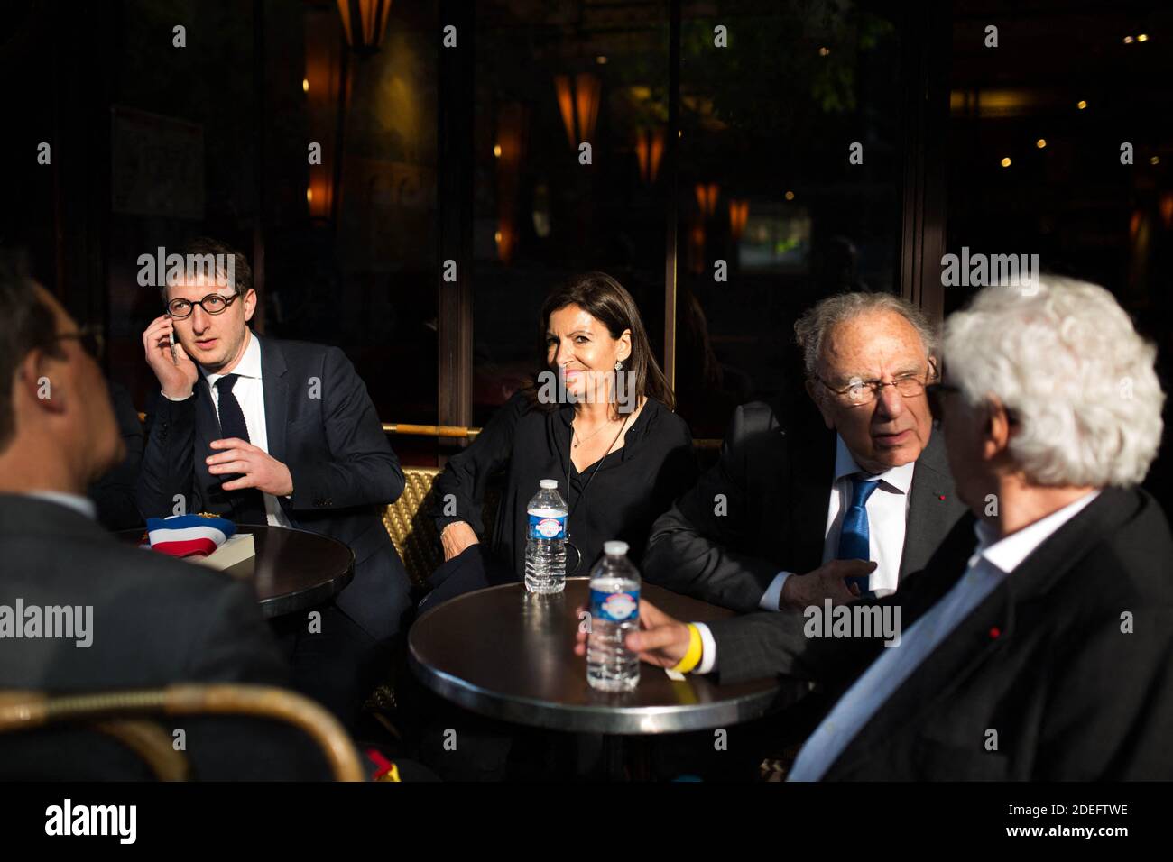 Anne Hidalgo stop to have a drink in a bar front of Notre Dame cathedral on April 18, 2019 in Paris. France paid a daylong tribute on April 18, 2019 to the Paris firefighters who saved Notre Dame Cathedral from collapse, while construction workers rushed to secure an area above one of the church's famed rose-shaped windows and other vulnerable sections of the fire-damaged landmark. Photo by Raphael Lafargue/ABACAPRESS.COM Stock Photo
