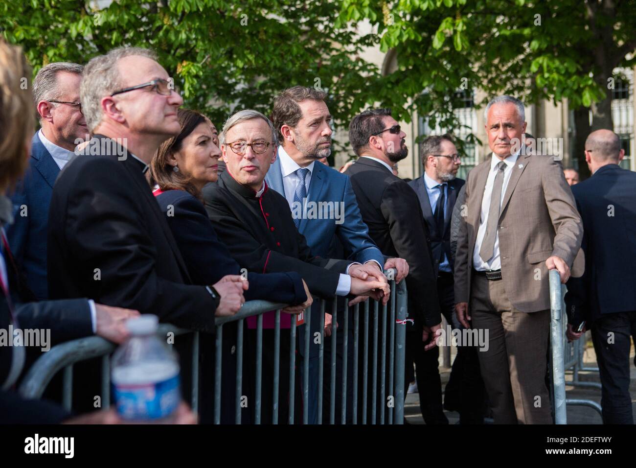 Jean-Claude Gallet General of the fire fighters of paris, Jean-Marc Chauve, French Interior Minister Christophe Castaner, Paris prefect Didier Lallement, Paris mayor Anne Hidalgo, and other officials walk by Notre Dame cathedral on April 18, 2019 in Paris. France paid a daylong tribute on April 18, 2019 to the Paris firefighters who saved Notre Dame Cathedral from collapse, while construction workers rushed to secure an area above one of the church's famed rose-shaped windows and other vulnerable sections of the fire-damaged landmark. Photo by Raphael Lafargue/ABACAPRESS.COM Stock Photo
