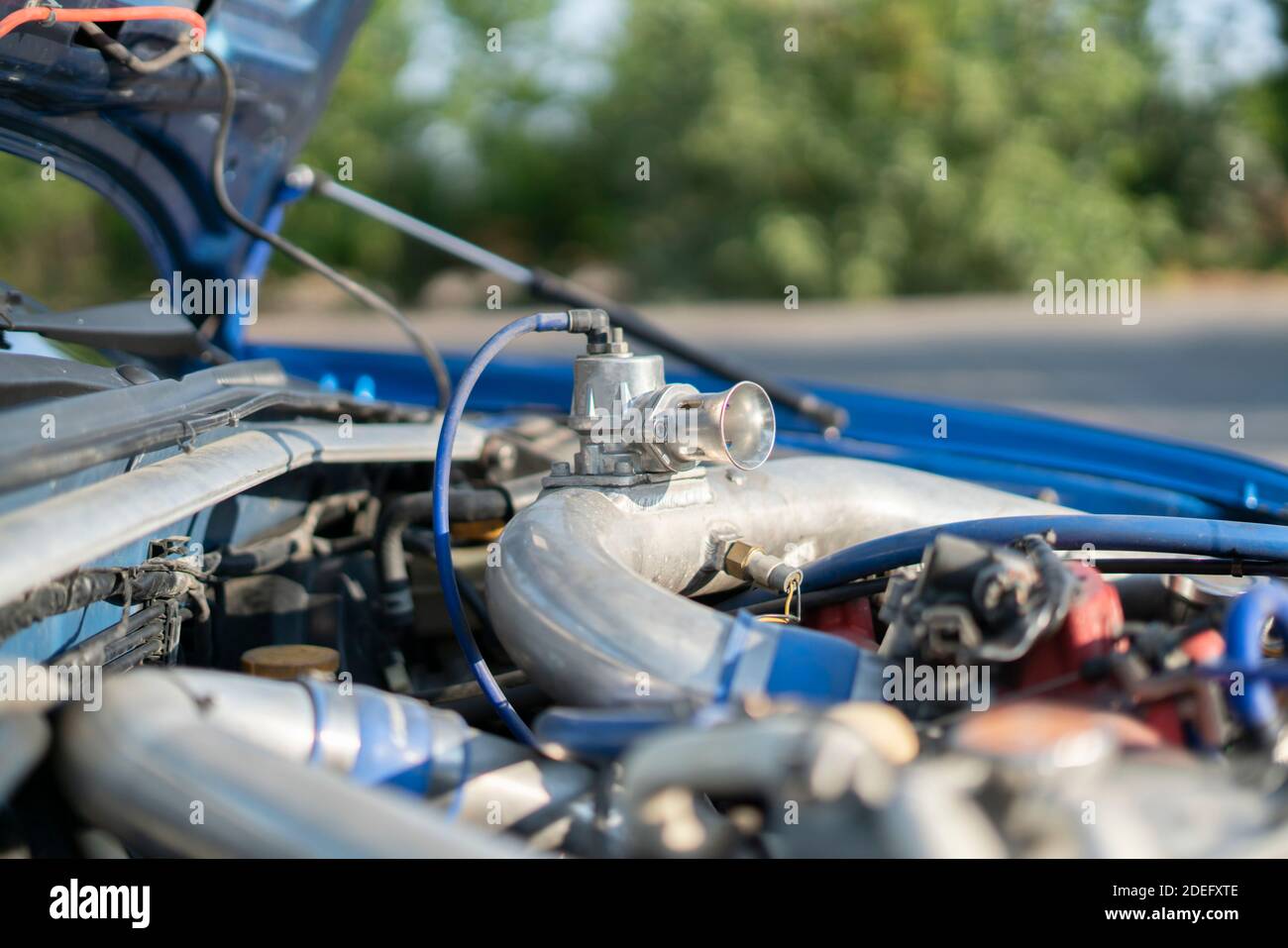 a close up details in the motor engine of a vehicle sport racer car ...