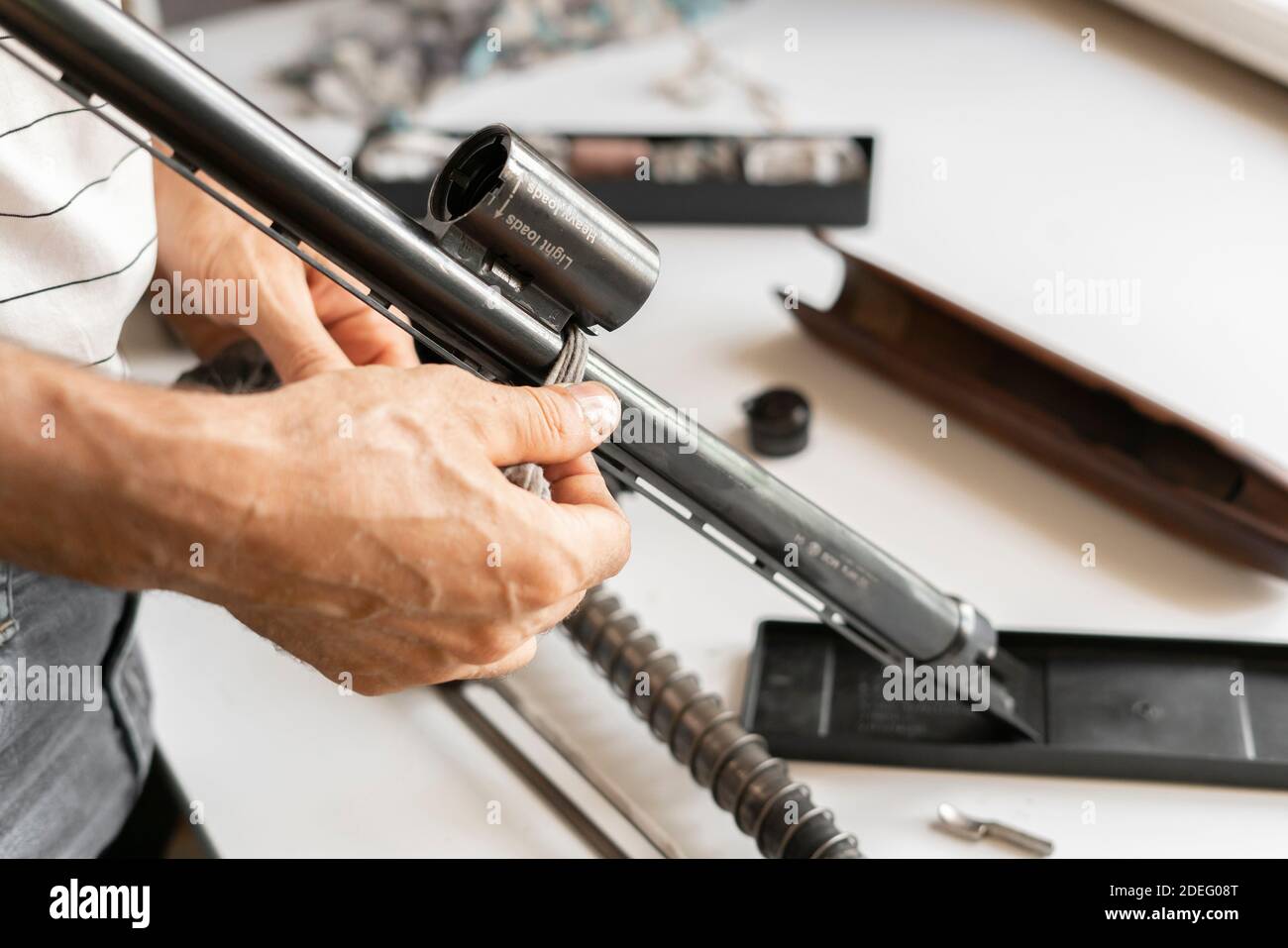the man's hands disassemble the classic shooting weapon rifle, sport hunting concept Stock Photo