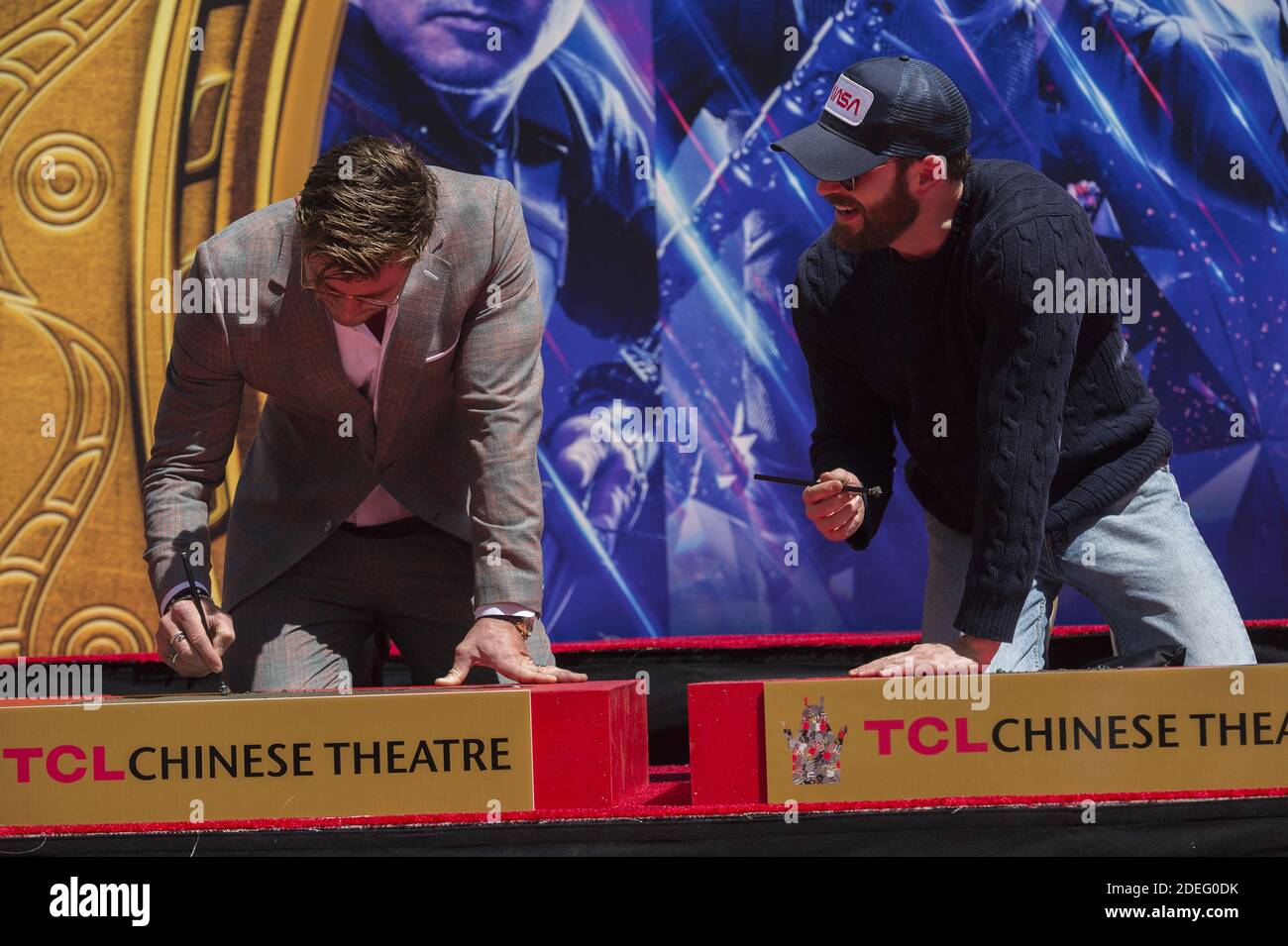 Chris Evans, Chris Hemsworth attend the Marvel Studios' 'Avengers: Endgame' cast place their hand prints in cement at TCL Chinese Theatre IMAX Forecourt at TCL Chinese Theatre IMAX on April 23, 2019 in Los Angeles, CA, USA. Photo by Lionel Hahn/ABACAPRESS.COM Stock Photo