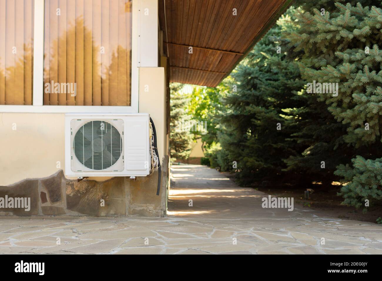 a split system air conditioner unit outdoors with air cleaning equipment Stock Photo