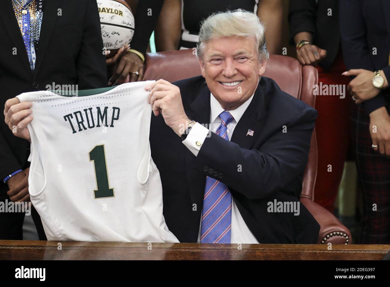 President Donald Trump holds a basketball jersey with his name on it from  head coach Kim Mulkey as he welcomes the 2019 NCAA Division I WomenâÂ€Â™s  Basketball National Champions, Baylor Lady Bears