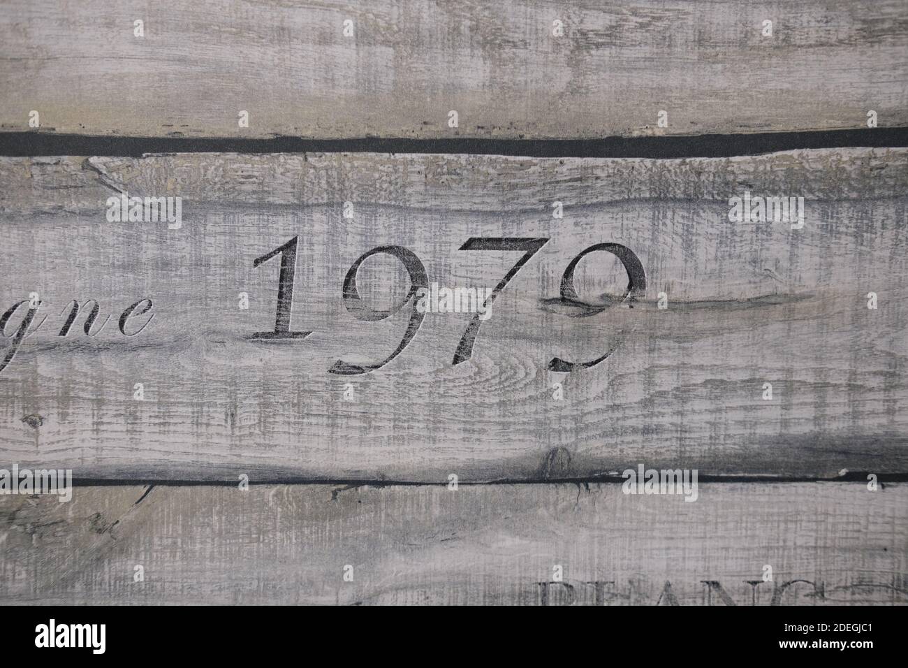 wooden texture of three planks with number 1979 embrassed on it Stock Photo