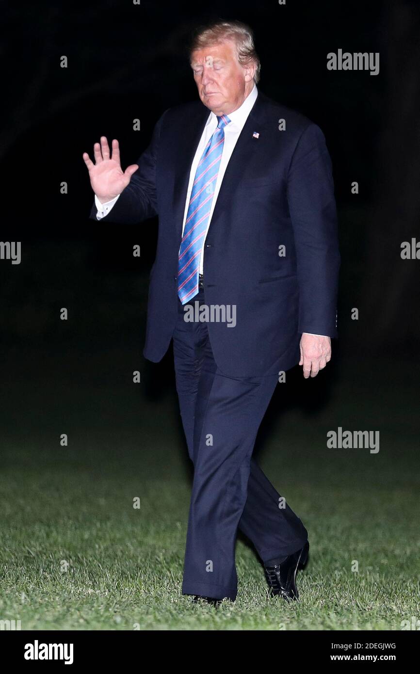 President Donald Trump walks on the South Lawn of the White House as he ...