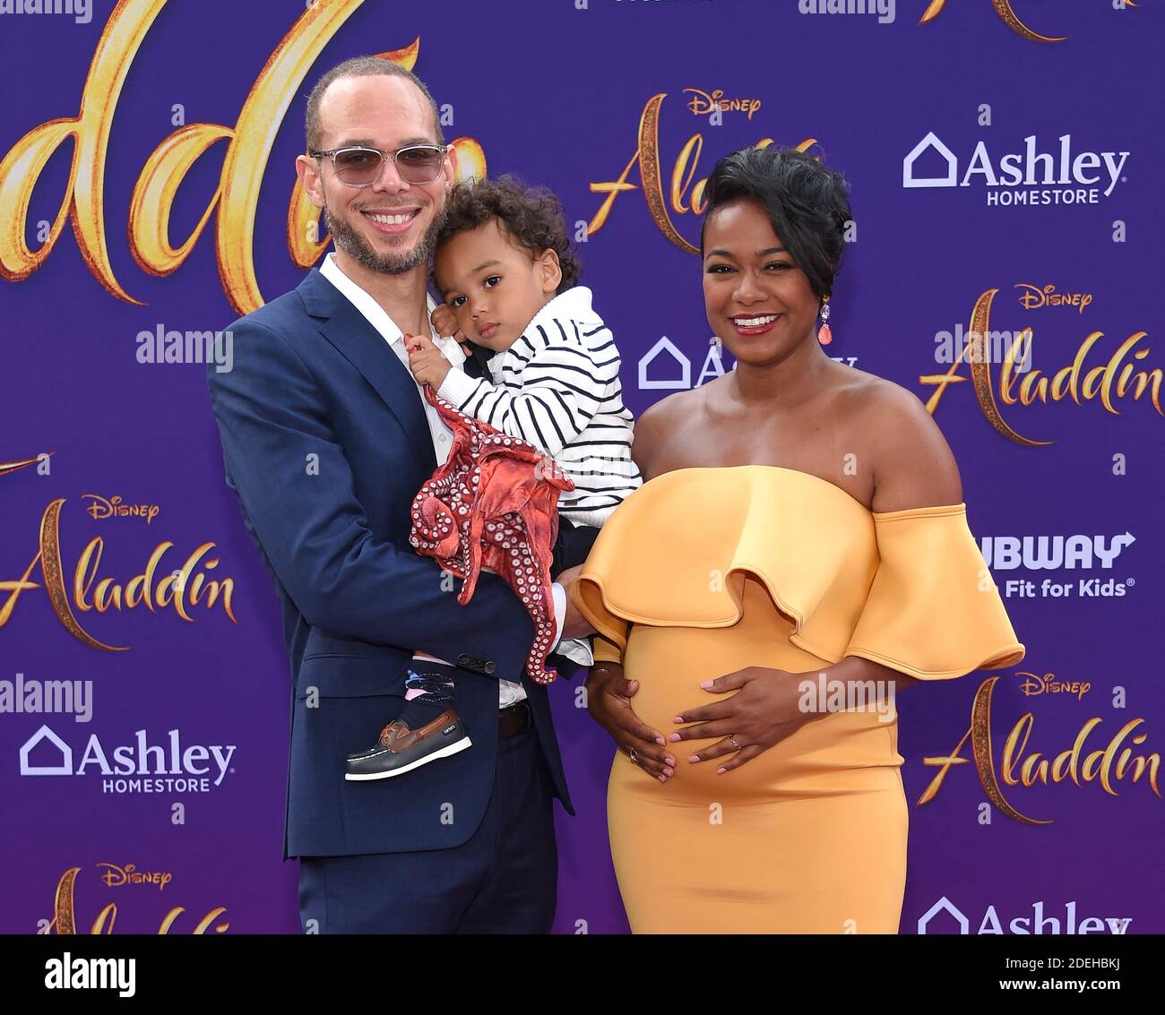 Vaughn Rasberry, Edward Rasberry and Tatyana Ali arriving to the