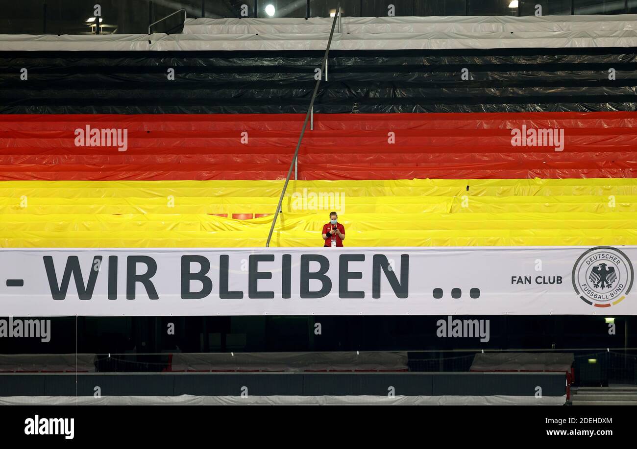 Stuttgart, Germany. 03rd Sep, 2020. Football: Nations League A, group stage, group 4, 1st matchday: Germany - Spain in the Mercedes-Benz Arena. One person stands on the otherwise empty stand, which is decorated in the German national colours. Credit: Christian Charisius/dpa/Alamy Live News Stock Photo