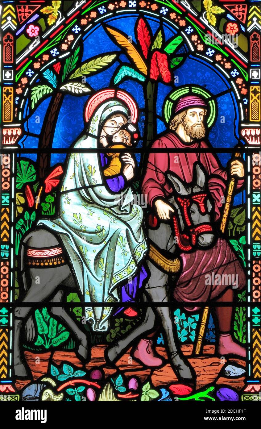 Flight to Egypt, Joseph, Mary, baby Jesus escape slaughter of new born males, stained glass window by Frederick Preedy, 1865, Gunthorpe, Norfolk Stock Photo