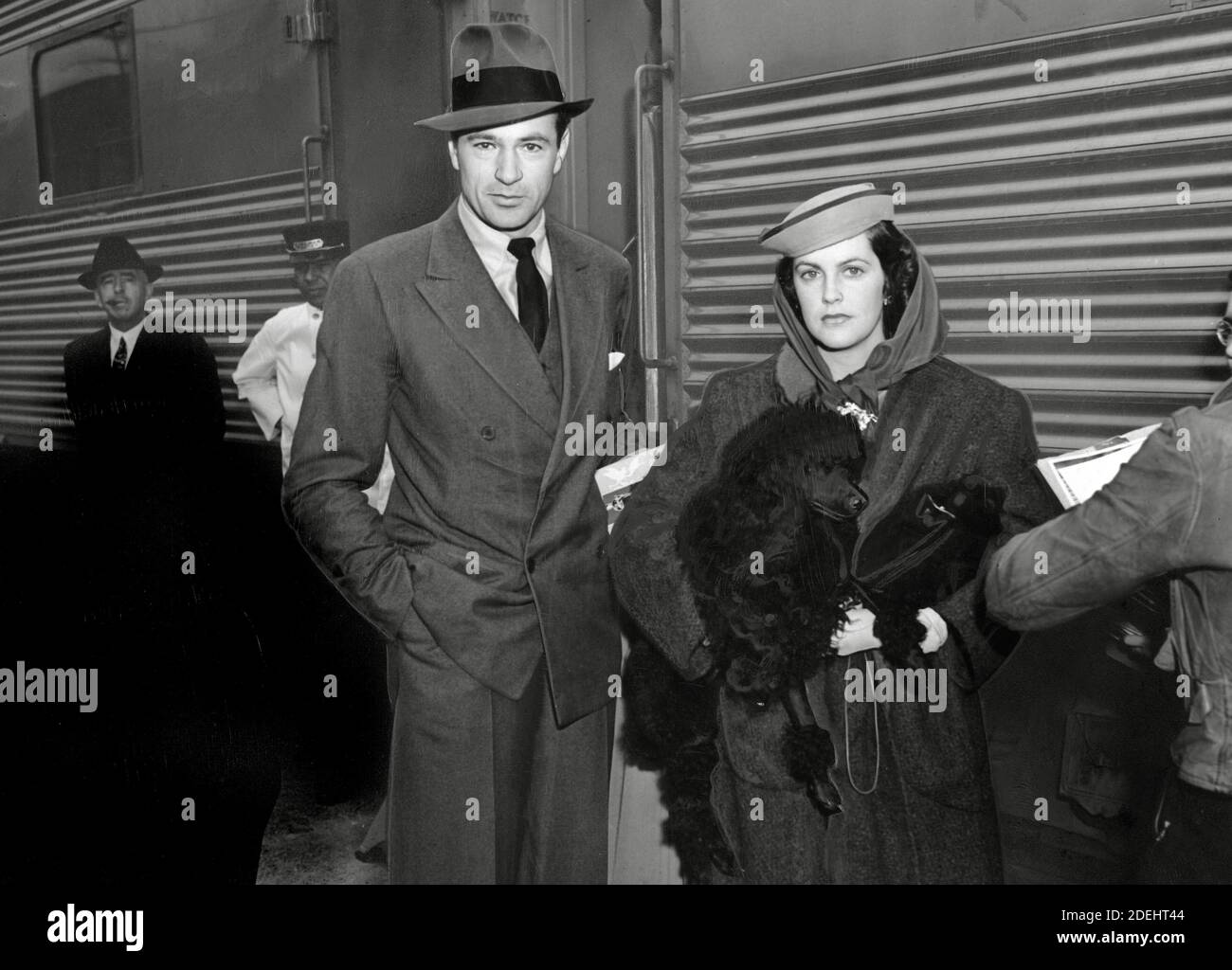 Gary Cooper arriving by train to Los Angeles, CA with his wife Veronica (Balfe) Cooper circa 1938 / File Reference # 34000-856THA Stock Photo