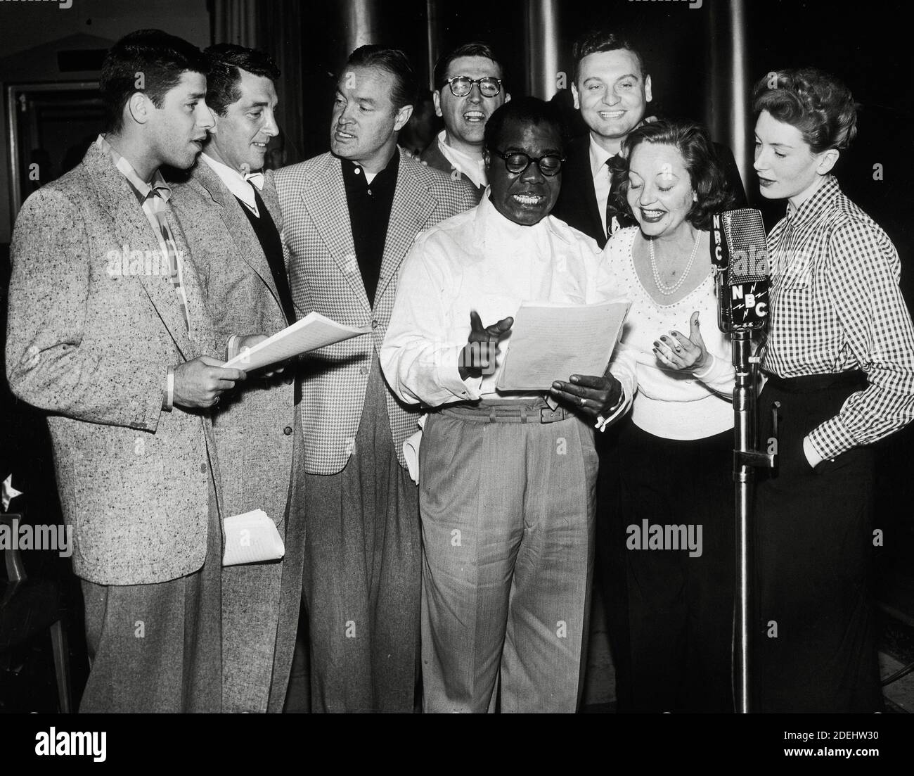 Jerry Lewis, Dean Martin, Bob Hope, Meredith Willson, Louis Armstrong, Frankie Laine, Tallulah Bankhead and Deborah Kerr, at an NBC radio broadcast, circa 1952 / File Reference # 34000-871THA Stock Photo