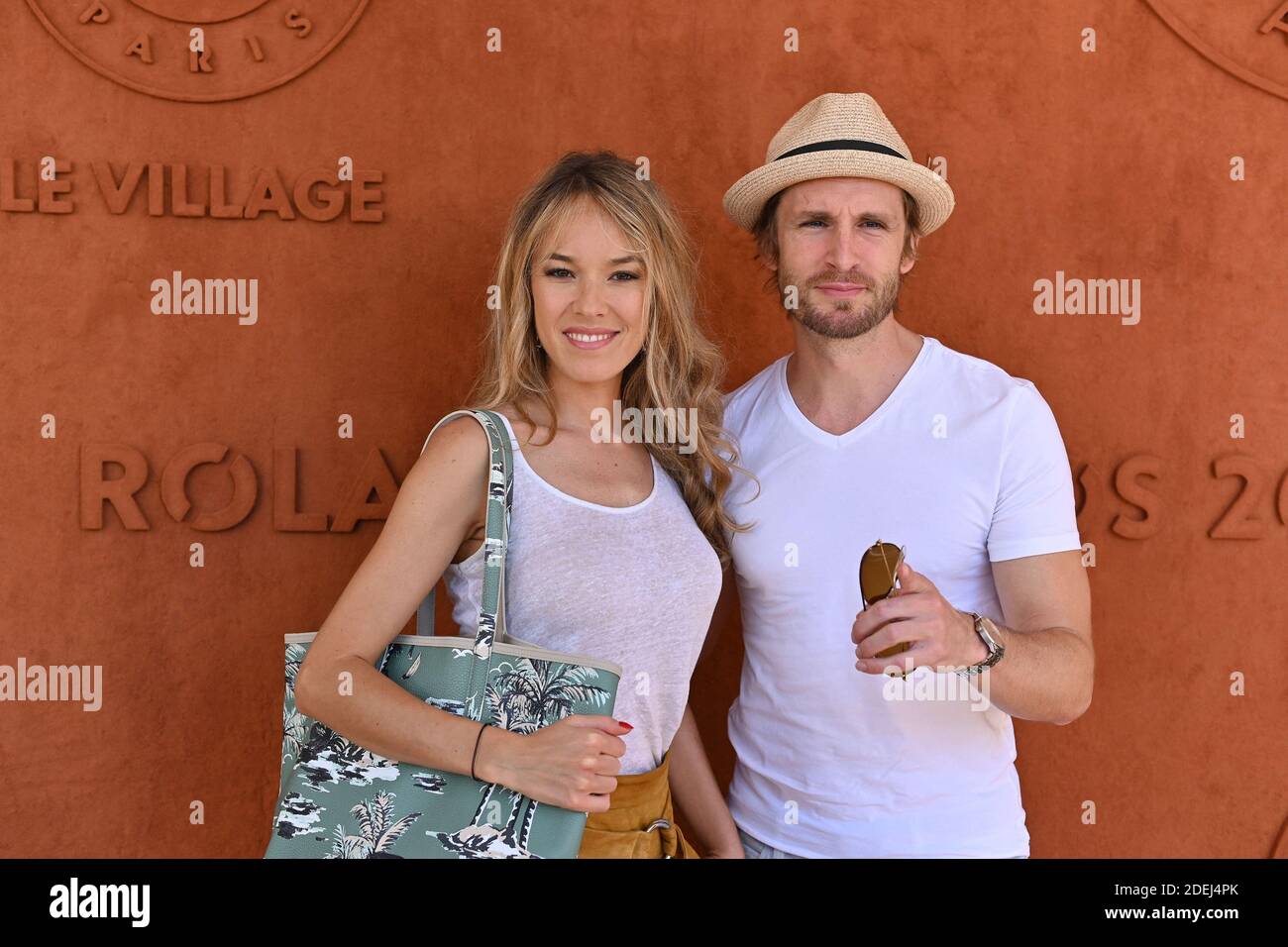 Actors Elodie Fontan and Philippe Lacheau in the village during French