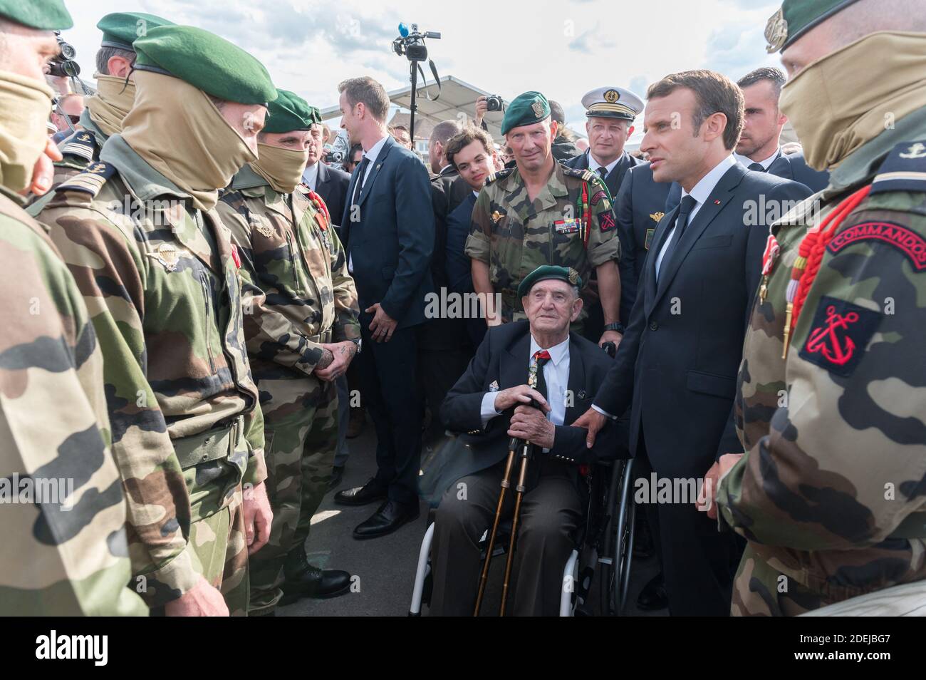French WWII veteran of the Commando Kieffer Leon Gautier (L) speaks with  French President Emmanuel Macron during a ceremony in tribute to the 177  French Fusiliers Marins of the "Commando Kieffer" who
