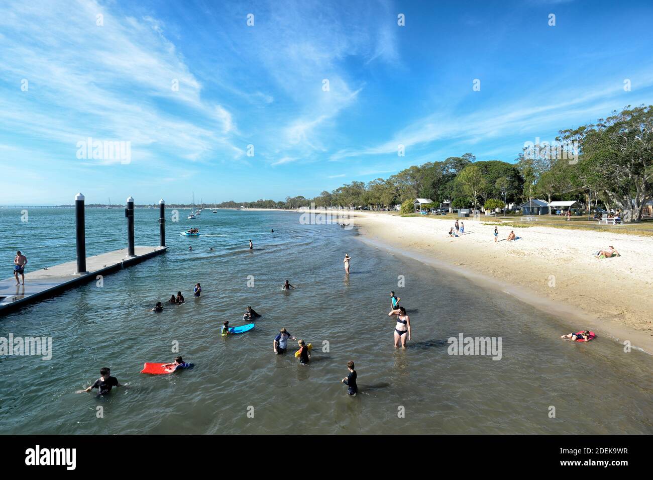 People swimming at popular Bongaree Beach, Bribie Island, Sunshine Coast, Queensland, QLD, Australia Stock Photo