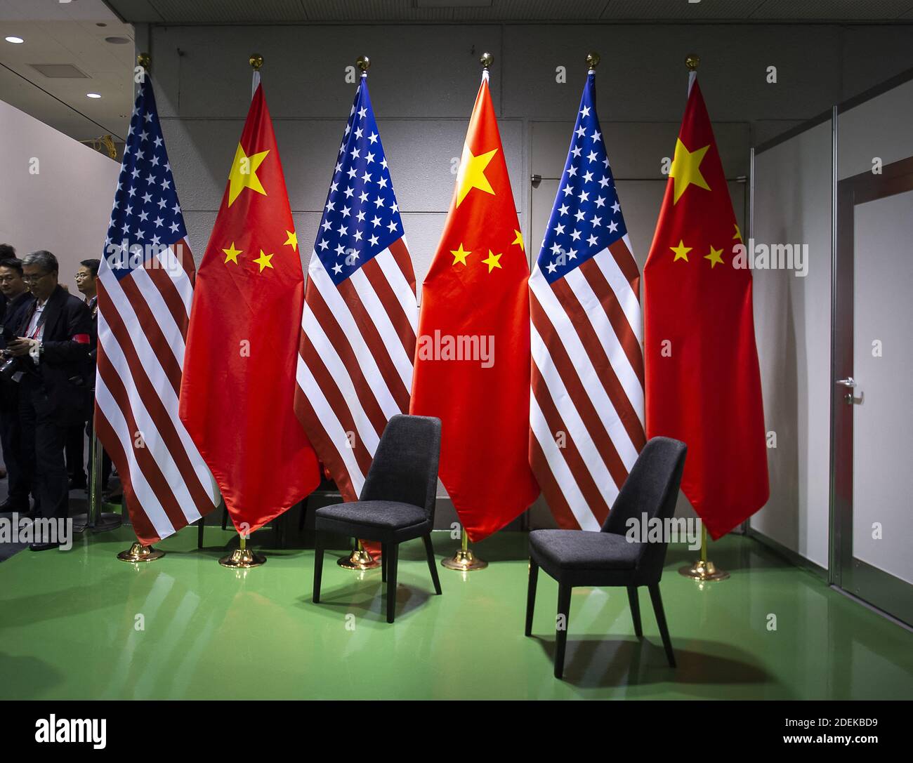 Members of Chinese Delegation in front of American US Flag and Chinese flag during a meeting between US President Donald Trump and China's President Xi Jinping at the G20 Summit in Osaka on June 29, 2019. Photo by Eliot Blondet/ABACAPRESS.COM Stock Photo