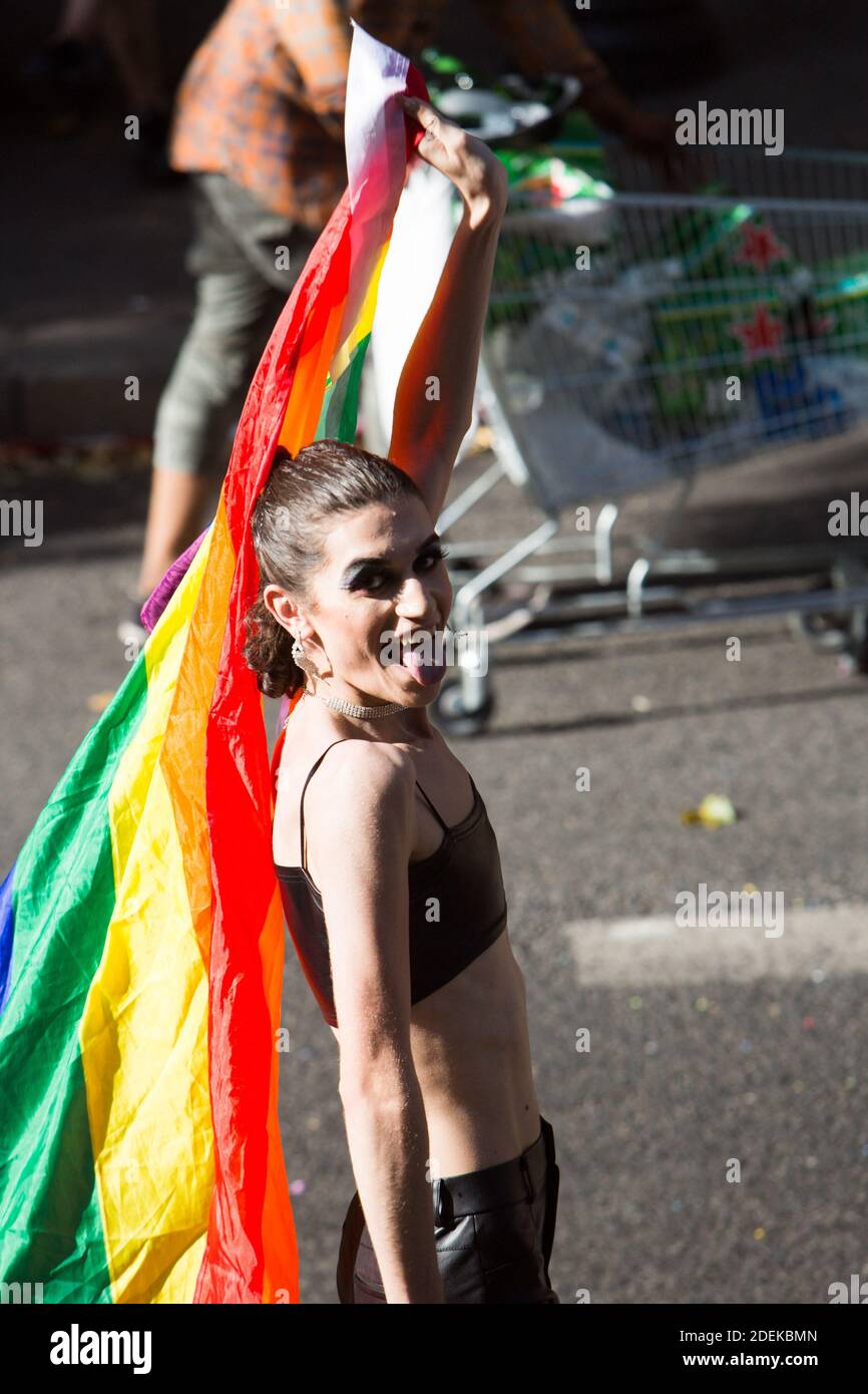 Cross dresser protester with a rainbow flag during the annual Gay Pride  parade, a 5.5km