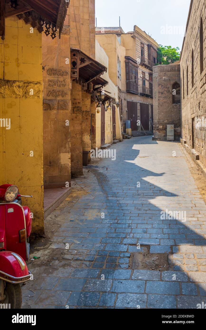 Cairo, Egypt - June 26 2020: Alley branching from historic Moez Street at Gamalia district, old Cairo, during Covid-19 lockdown period with closed shops and no pedestrians Stock Photo