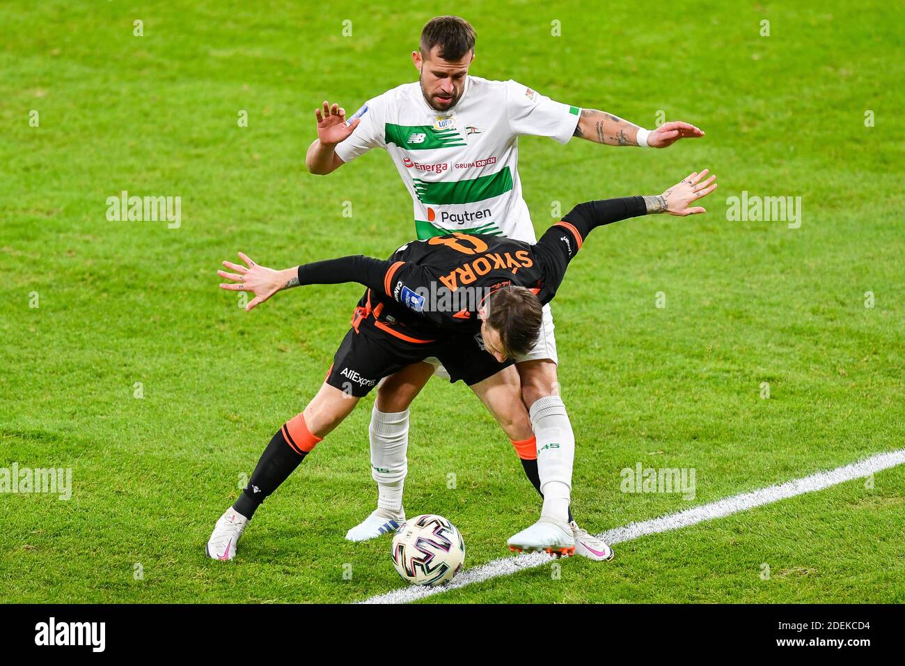 Gdansk, Poland. 30th Nov, 2020. Jan Sykora of Lech (L) and Rafal Pietrzak of Lechia (R) are seen in action during the Polish Ekstraklasa match between Lechia Gdansk and Lech Poznan.(Final score; Lechia Gdansk 0:1 Lech Poznan) Credit: SOPA Images Limited/Alamy Live News Stock Photo
