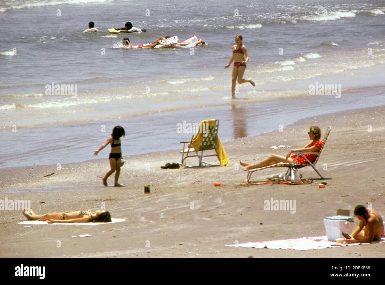 1970s Photo (1973) -   Swimming in the Gulf of Mexico from West Beach, part of the long stretch of open shoreline that makes Galveston a popular gulf coast resort Stock Photo