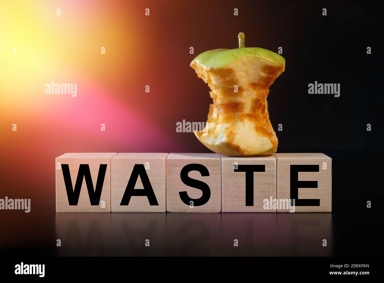 An apple core and the word WASTE are written on the cubes. Organic and