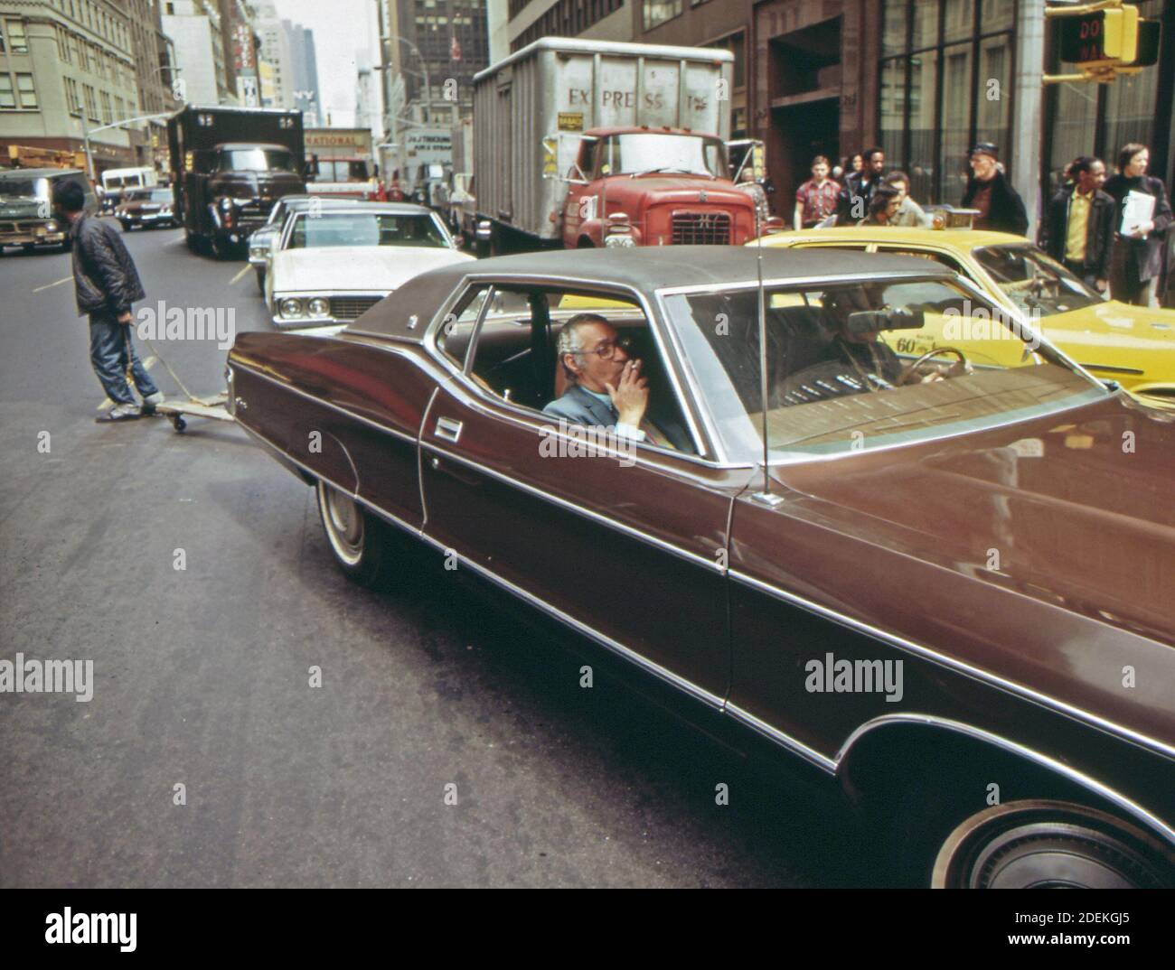 1970s Photo (1973) -  Large car moves slowly through Manhattan traffic (New York City) Stock Photo