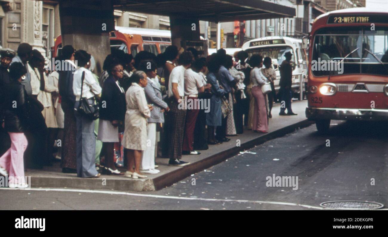 Passengers in Atlanta; Georgia; waiting for their Metropolitan Atlanta Rapid Transit Authority (MARTA) bus during rush hour.  ca. 1974 Stock Photo