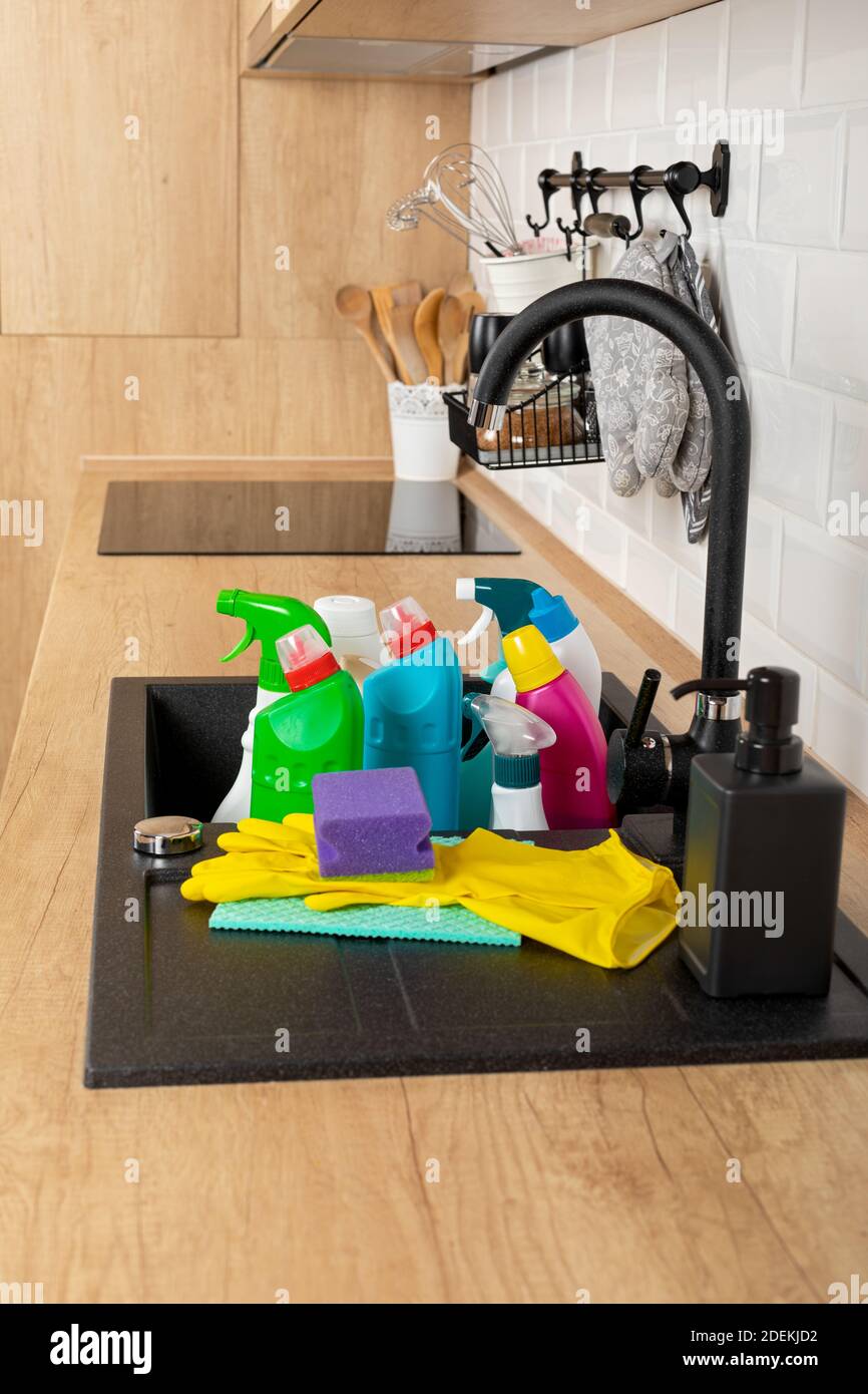 Colorful cleaning products in the kitchen Stock Photo - Alamy