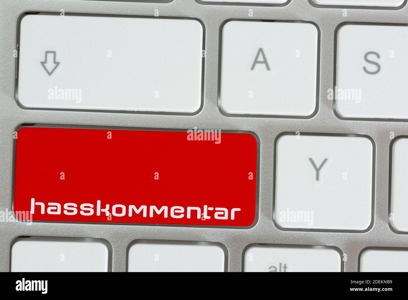 A computer and hate comment button Stock Photo - Alamy
