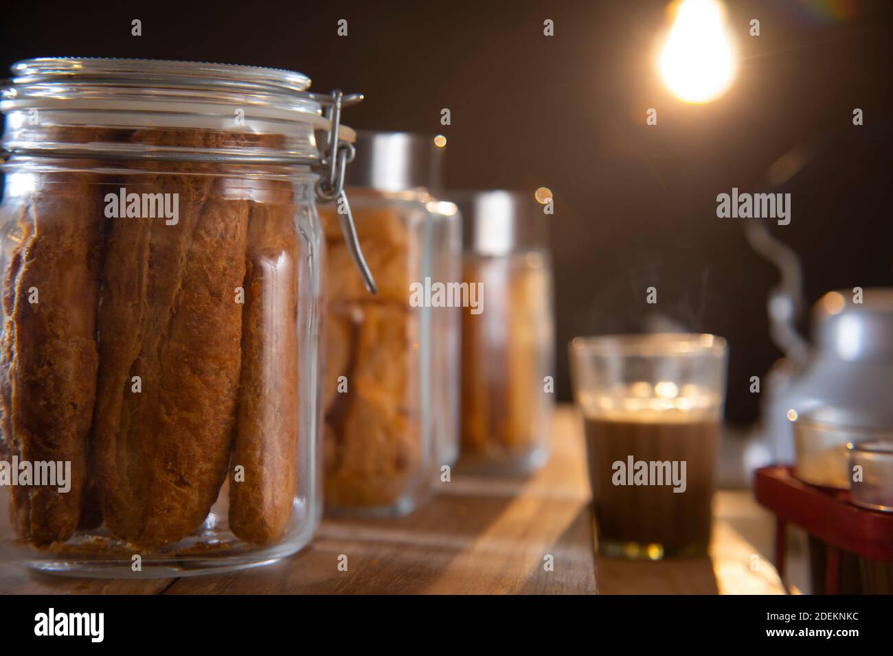 Fan Rusk Jars of fan, matthi and rusk kept with tea glass and kettle in a tea ...