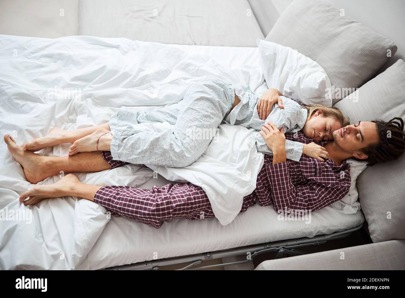 Beautiful couple in love sleeping together in bed Stock Photo - Alamy