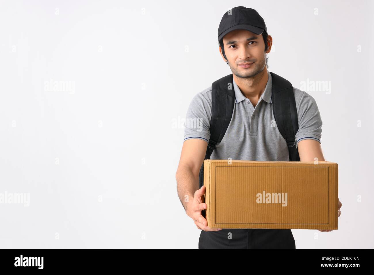 Courier boy with his bag pack on delivering the parcel Stock Photo Alamy