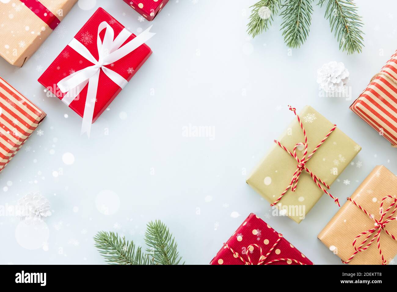 Christmas and New Year holiday background with copy space, creative idea border design with gift boxes, green pine and white snow Stock Photo