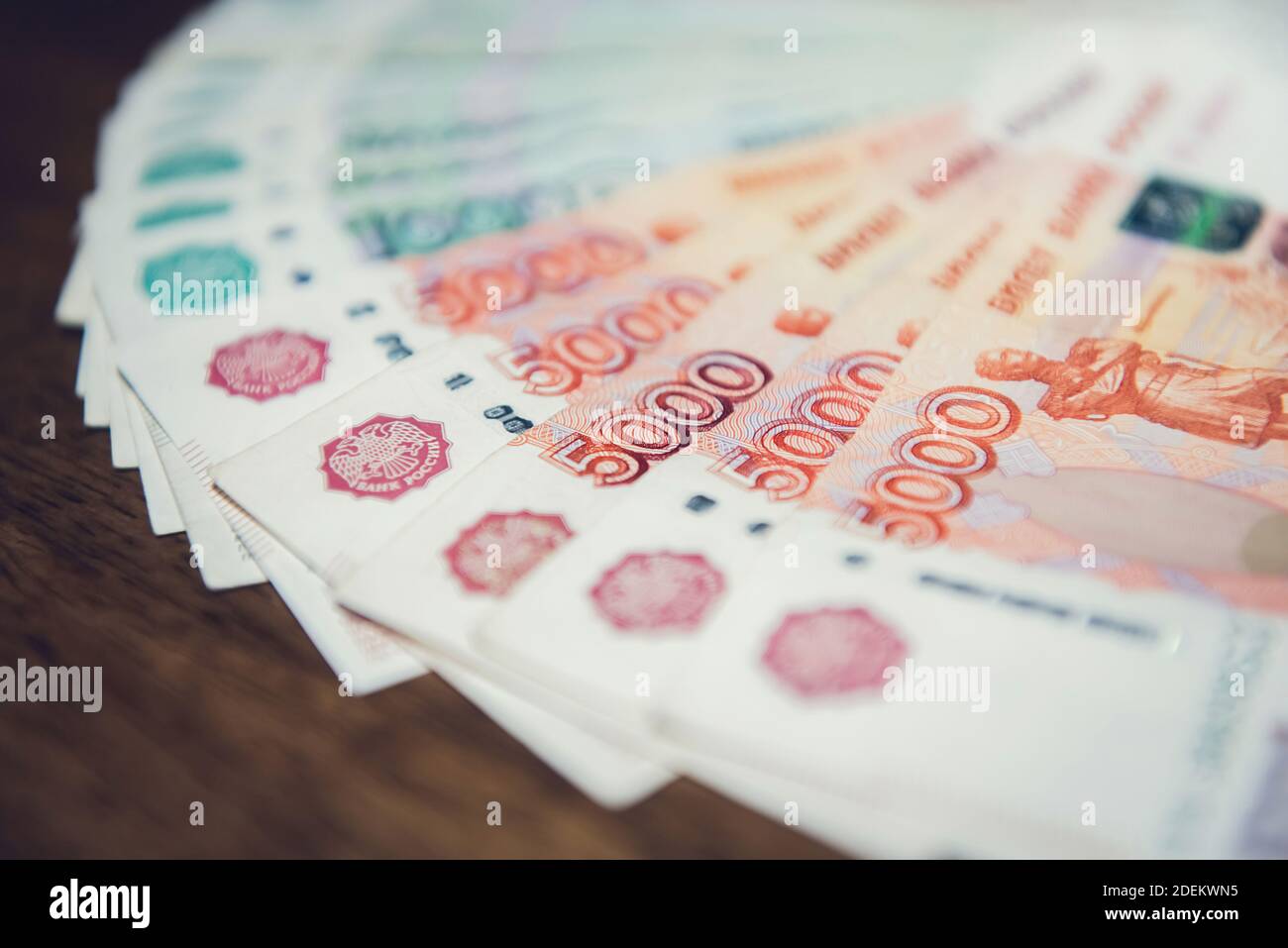 Close up of money, Russian rubble currency banknotes, on wood table - loan, financial and investment concepts Stock Photo