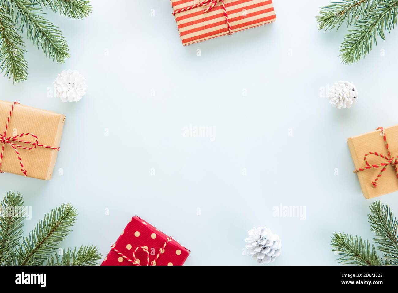 Christmas and New Year holiday background with copy space, creative idea border design with gift boxes, green pine and decorating items Stock Photo
