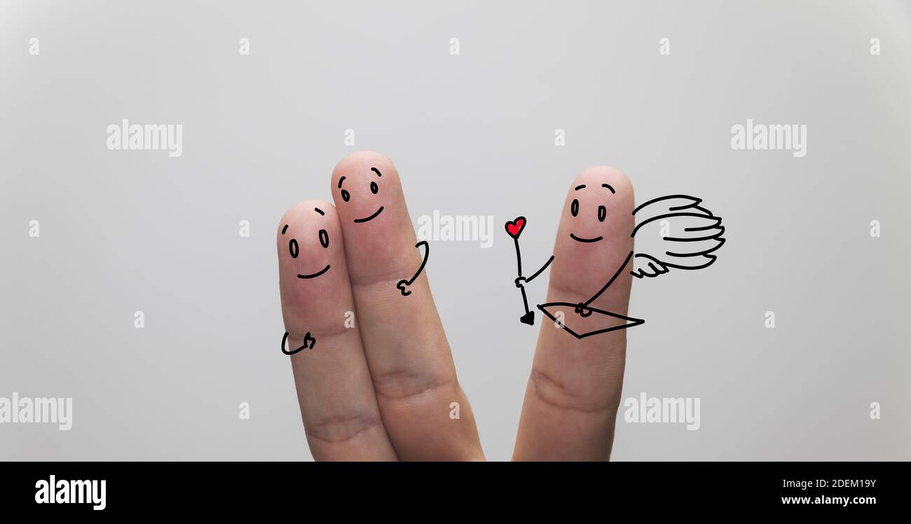 A closeup shot of finger couple in love, with cupid finger aside Stock Photo