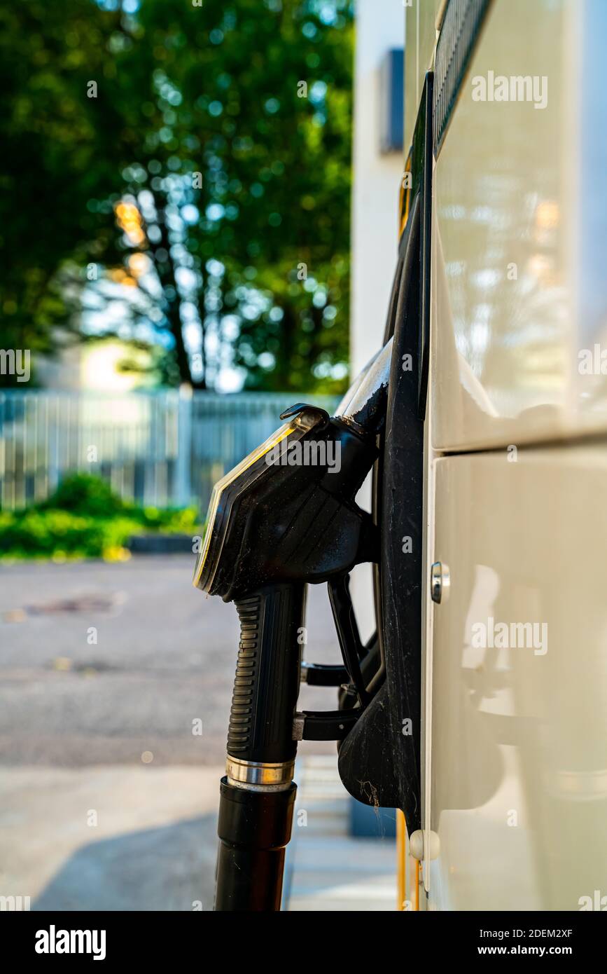 Close up of handle and nozzle of a gas station fuel pump. . High quality photo Stock Photo