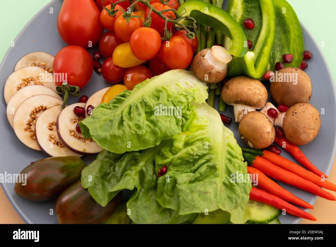 Close up of freshly cut vegetables on grey plate Stock Photo