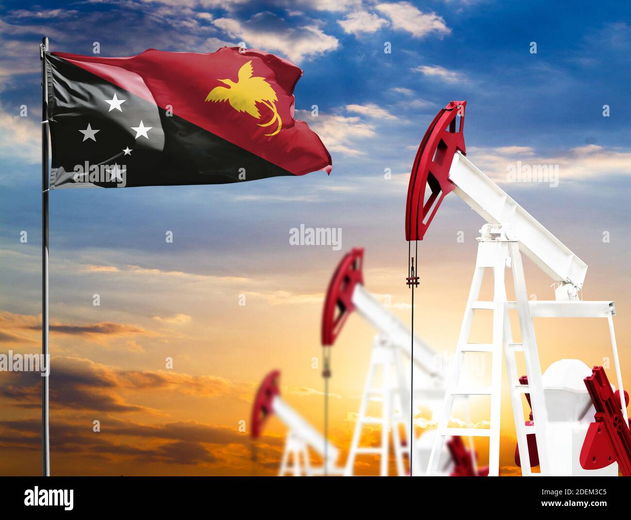 Oil rigs against the backdrop of the colorful sky and a flagpole with ...