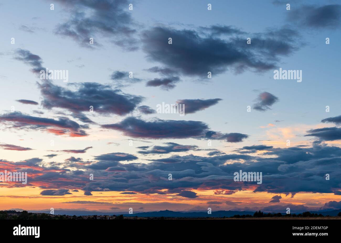 Sky background at sunset with blue clouds and mountain range Stock ...