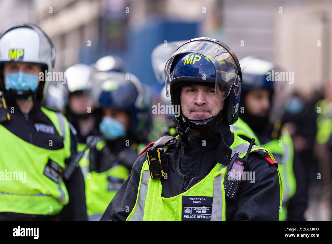 Anti-lockdown protest, Regent Street, London, 28 November 2020. Portrait of a a middle-aged police officer in riot helmet. Stock Photo