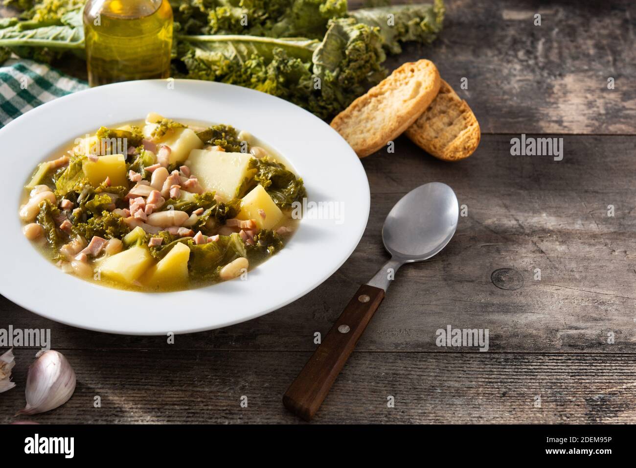 Creamy Tuscan soup on wooden table Stock Photo