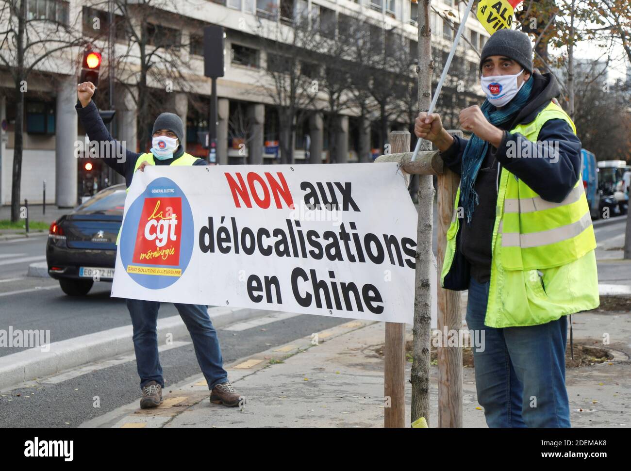 Workers on strike from the General Electric (GE) plant in Villeurbanne,  demonstrate in front of the Bercy Finance Ministry in Paris, France,  December 1, 2020. The banner reads " No to relocations