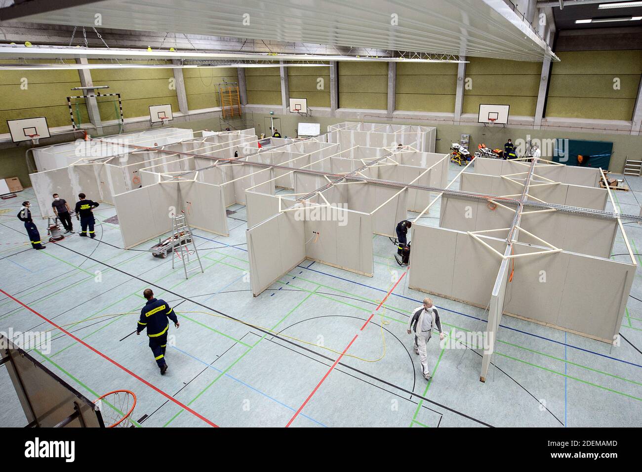 Eschwege, Germany. 01st Dec, 2020. Helpers from the Federal Agency for Technical Relief (THW) are setting up a vaccination centre in the sports hall of the upper secondary school. In Eschwege in the Werra-Meissner district, a vaccination centre is being set up by the district and various disaster control organisations. Credit: Swen Pförtner/dpa/Alamy Live News Stock Photo